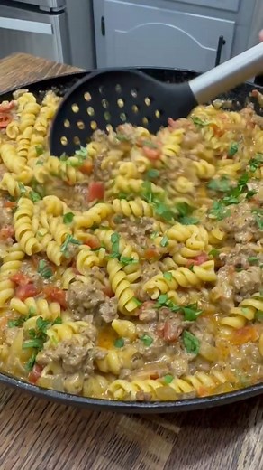 This taco hamburger helper makes an easy weeknight dinner! Recipe 1 lb of ground beef 1 chopped onion 1 1/2 cups of beef broth 1 1/2 cups of milk 2 1/2 cups of Rotini Pasta 1 10oz can of Rotel (not drained) 1/2 tsp salt 2 tsp chili powder 1 tsp each of cumin, dried cilantro, black pepper, and paprika 1 TBSP minced garlic 2 cups of shredded cheese Fresh cilantro Instructions • brown ground beef with chopped onion •drain grease • season with salt, pepper, chili powder, cumin, dried cilantro, and p