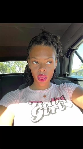 Person Talking in Car with 'Baby Girl' T-Shirt