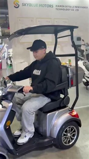 Customer Test Ride Skyblue Beetle 4 Wheel Scooter with Roof at EICMA 2025