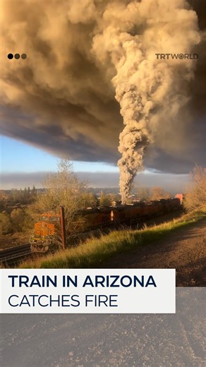 21K views · 168 reactions | A train in Arizona, United States caught fire on May 15, sending large plumes of smoke into the sky. The train's onboard fire suppression system had the fire controlled and stopped it from spreading onto the ground. | TRT World | Facebook