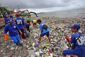 Sanitation workers gather tons of trash during Baywalk clean-up