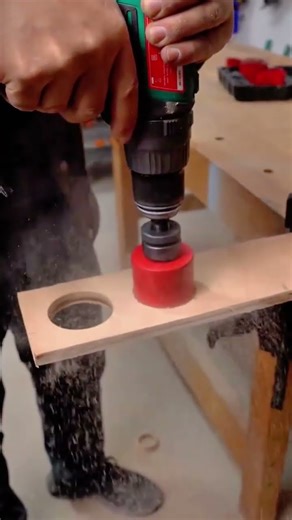 Using a powerful drill and large hole saw to cut perfect circles in wood