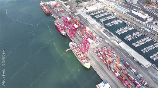 Watch as large container ships dock and unload shipping containers at a busy cargo port. This dynamic environment highlights the vital role of maritime logistics in global trade.