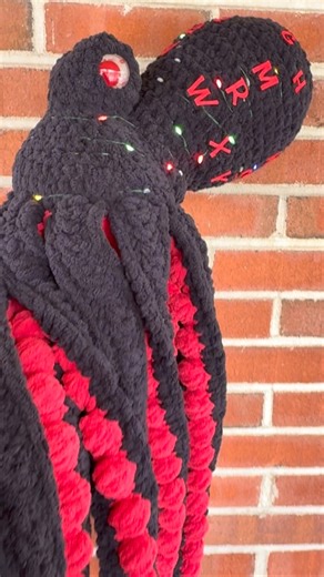 🐙 When I was commissioned to make a Stranger Things “Upside Down” octopus I knew it would be a fun project. I had a vision of lights and the alphabet wall and just had to add them in. Thank you @mr_potteiger for trusting me and I’m so glad he went out to a loving home ❤️ Octopus pattern @humblechild.co Yarn Big Twist Yarn Lights @michaelsstores Eyes @floralsandfeathers in “Dexter” glow #strangerthings #octopus #theupsidedown #christmasgift #crochet | Florals And Feathers