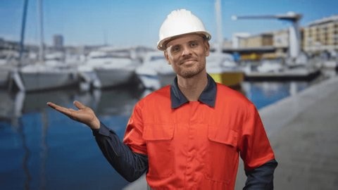 clip-4047344917-man-builder-hardhat-holds-palm-open-hand