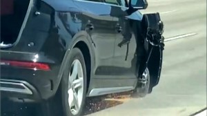 Car Tears Down Freeway on 3 Wheels And Open Tailgate
