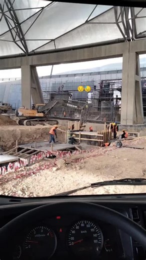 Construction Workers in Action at a Busy Site