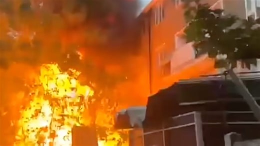 Massive fire erupts at residential block in London as crews battle past smoke