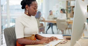 Business woman, typing and working on computer for online marketing, copywriting and web editing. Professional worker, writer or african editor typing, research or email on desktop at creative agency