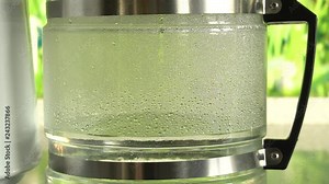 Production of clean water or alcohol. Table home or chemical laboratory Distiller for production of pure water. Process of cleaning fluid. Alcohol mashine. Close up