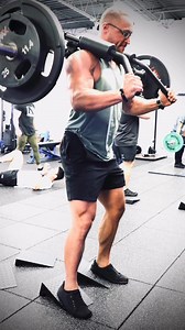 The PRIME Super Squat Bar is designed with angled, elongated handles...