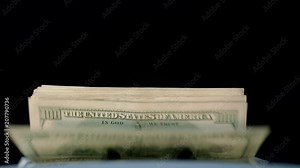 Bank financial operations. Electronic cash counting machine calculating dollar banknotes. Money counting machine. Bank automatic equipment for counting paper money. Money income concept