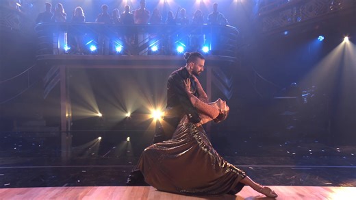 Now she’s shinin’ like she’s born to be 🤩 Whitney Leavitt and pro Mark Ballas are GLOWING in the #DWTS ballroom with their golden Tango! | Dancing with the Stars
