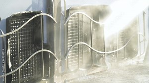 Close up handheld pressure washing car floor mat. Car wash self-service. A man washes the machine with high-pressure equipment