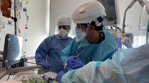 Officials urge mask-wearing as ‘tripledemic’ threat grows