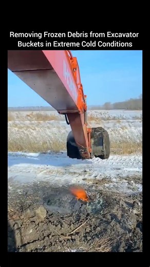 Removing Frozen Debris from Excavator Buckets in Extreme Cold Conditions.