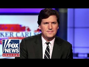 Antifa protesters chant outside Tucker Carlson's home