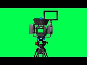 Dslr camera with green screen for video shooting on the tripod with green screen - free use