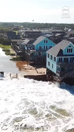 Aerial footage captured a tidal storm surge enveloping homes in North Carolina’s Outer Banks on Tuesday, as Hurricane Erin continued to move through the Atlantic Ocean. https://abcnews.visitlink.me/kHGGgy | ABC News