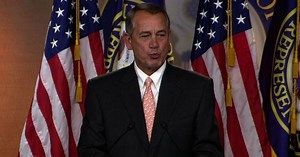 John Boehner blows kisses at a reporter