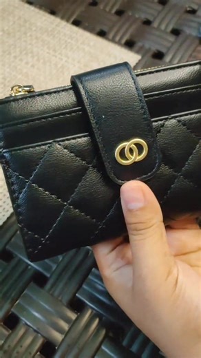 Unboxing a Stylish Black Wallet with Gold Logo
