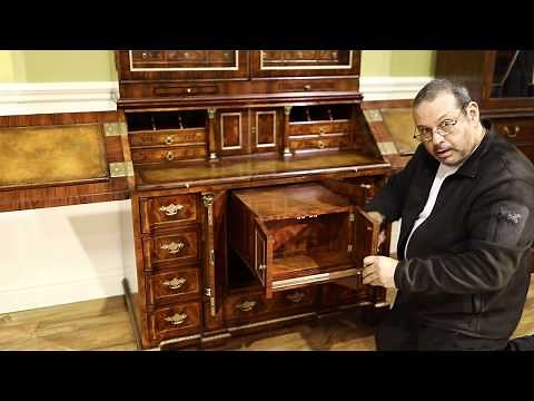 Secretary desk with secret compartments. Brass and leather top slant-lid desk