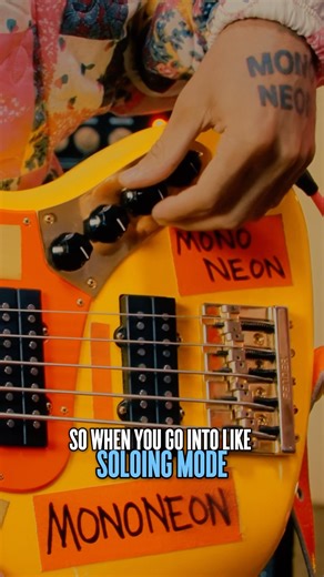 ‪@TheMonoNeon‬ shows off his SIGNATURE BASS, complete with sock & stickers!