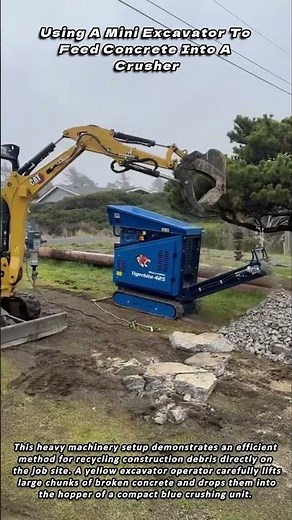 Using A Mini Excavator To Feed Concrete Into A Crusher