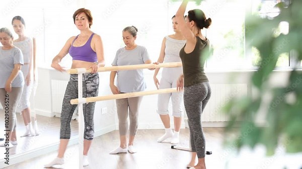 Female amateurs of choreographic lesson learn from experienced master of theatrical dance. High quality 4k footage