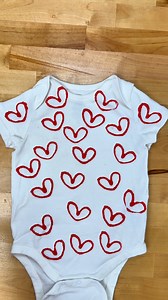 Adorable onesie craft ❤ Learn how to make hearts for Valentine's Day onesies and more using an empty toilet paper roll. #mom #onesie #valentinesday #makingclothes | Momma Might Know Best