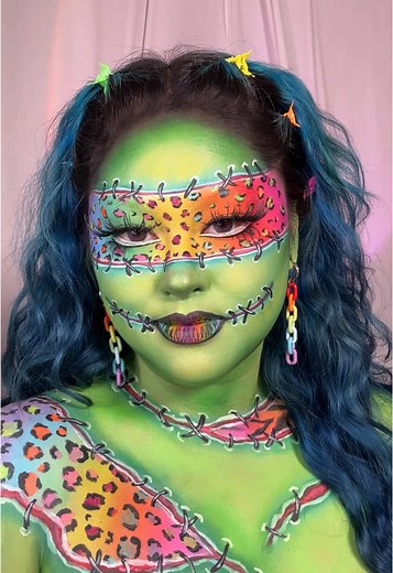 Happy 1st day of Halloween!! 🌈🧟‍♀️💚✨ Ive had this idea in my head forever lol @Lisa Frank @Blend Bunny Cosmetics blends palette @Mehron Makeup clown white, paradise fx neon paint palette red, white & black paradise paint @makeupbymario master mattes liquid liner @Glisten Cosmetics LTD green yellow spectra base . . . #frankenstein #halloweenmakeup #halloweenmakeuplook #lisafrank #bodypaint #facepaint