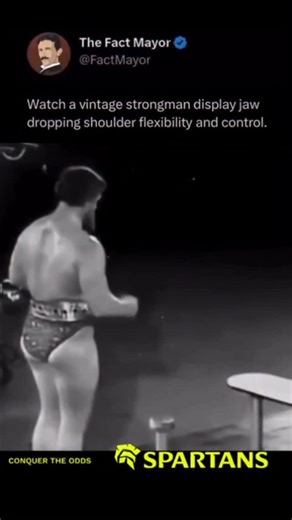 Fact Mayor on Instagram: "This vintage footage showcases a professional strongman from the early 20th century performing an extraordinary display of shoulder flexibility, balance, and control — qualities often overlooked in modern strength training. His movements reveal a mastery of body awareness and discipline that went beyond mere muscle power. Unlike today’s focus on lifting heavier weights, strongmen of that era blended strength with elegance, treating their performances as both sport and a