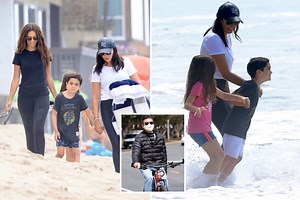 Simon Cowell's girlfriend takes their son Eric to the beach after his back break