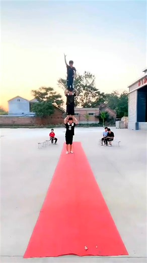 Amazing acro-balance skills! ✨ Standing tall on your friend's shoulders—teamwork at its best! #BalanceGoals #Teamwork #AcroLove | Josephine J. Babcock | Facebook