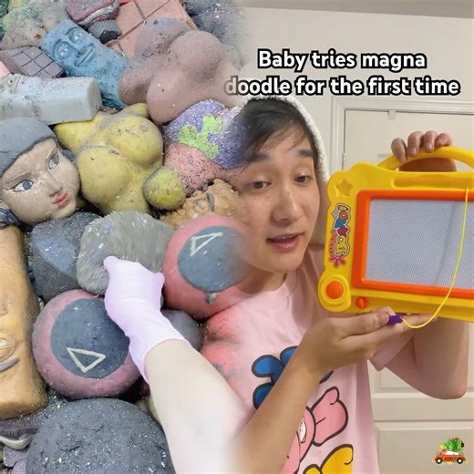 Baby tries the magna doodle for the first time