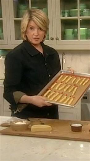 Sugar cookie "fingers" and almond "nails" come together to create an eerie dessert that's perfect for your Halloween celebration. Arrange the fingers in a bowl of cookie crumbs and watch your guest shriek at the sight: bit.ly/3JsQk0N | Martha Stewart