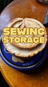 ntroducing my cookie tin sewing storage. I have this problem where I put things away and forget they exist. I either forgot where I put the stuff or completely forget I even own the stuff. But maybe if I make really weird food related storage containers I’ll remember where the stuff is. Probably not though Video description: We see a small round table with a large fried egg and a blue tin of Danish butter cookies. The camera moves past to show a giant fake danish butter cookie that is also a tin
