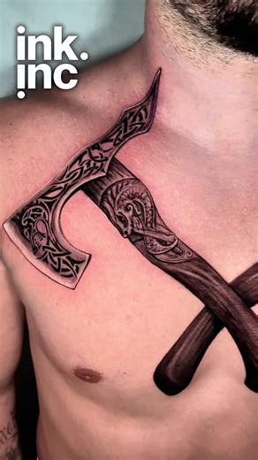 Full chest tattoo featuring a detailed Viking axe design with intricate Norse-inspired patterns, bold linework, and smooth black and grey shading. A powerful statement piece combining mythology, warrior symbolism, and custom composition designed to flow naturally across the chest. Perfect inspiration for anyone searching for Viking tattoos, axe tattoos, Norse mythology tattoos, or bold black and grey chest tattoo ideas. #VikingTattoo #ChestTattoo #BlackAndGreyTattoo #NorseTattoo #TattooArt