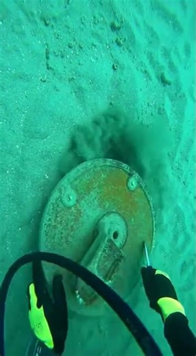 First person underwater bodycam footage true 4K excellent visibility diver cracks open a buried hatc