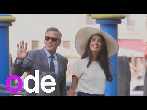 George Clooney and new wife Amal Alamuddin arrive by boat for their civil wedding ceremony