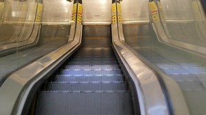 An escalator going down top view