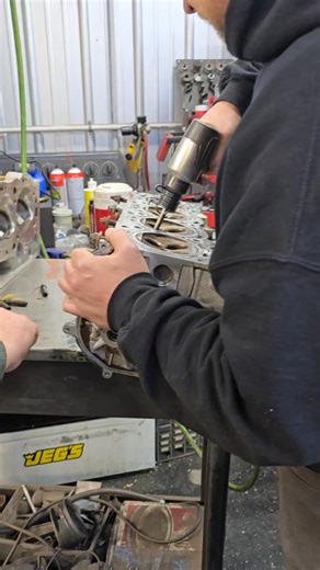 Ever wonder how they get valve guide out of a head to install new ones? Ran the VK56's head over to Franz Machine shop to knock them out so Jarvis could do a light port before the upgraded valve train goes in today. | Mad Scientist Auto