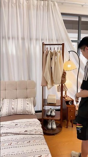 An aesthetic full-length mirror and storage rack all in one.