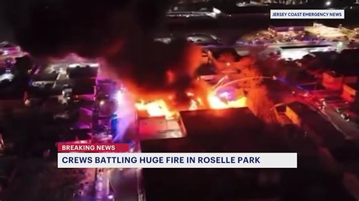 Crews battle large fire inside Roselle Park flooring company building