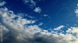 Clouds on a clear blue sky. Beautiful white clouds background