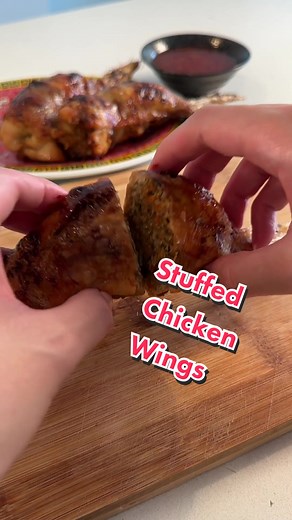 Stuffed chicken wings are a staple food in Hmong cuisine. The wings are deboned and stuffed with a pork and noodle filling, then baked until crispy. 😋🤩 This dish is not eaten often and usually saved for special occasions, since it’s very time consuming to make. But, if you have the time and extra help in the kitchen, you won’t regret making this! Thanks to @Jasmine and Tea #hmong #stuffedchickenwings