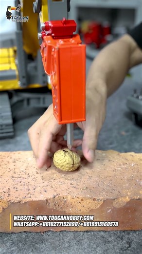 The 1/18 electric lifting RC excavator 5901 100S instantly transforms into a walnut-opening tool