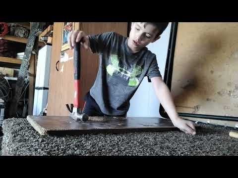 Bored smashing a plank of wood