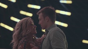 Couple Kiss While Slow Dancing Under Lights