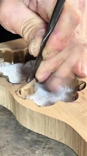 carving wooden materials with sharp tools into complex shapes by hand using steady pressure daily